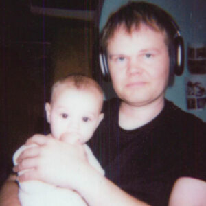 Dad holding Little Ben when he was nearly brand new